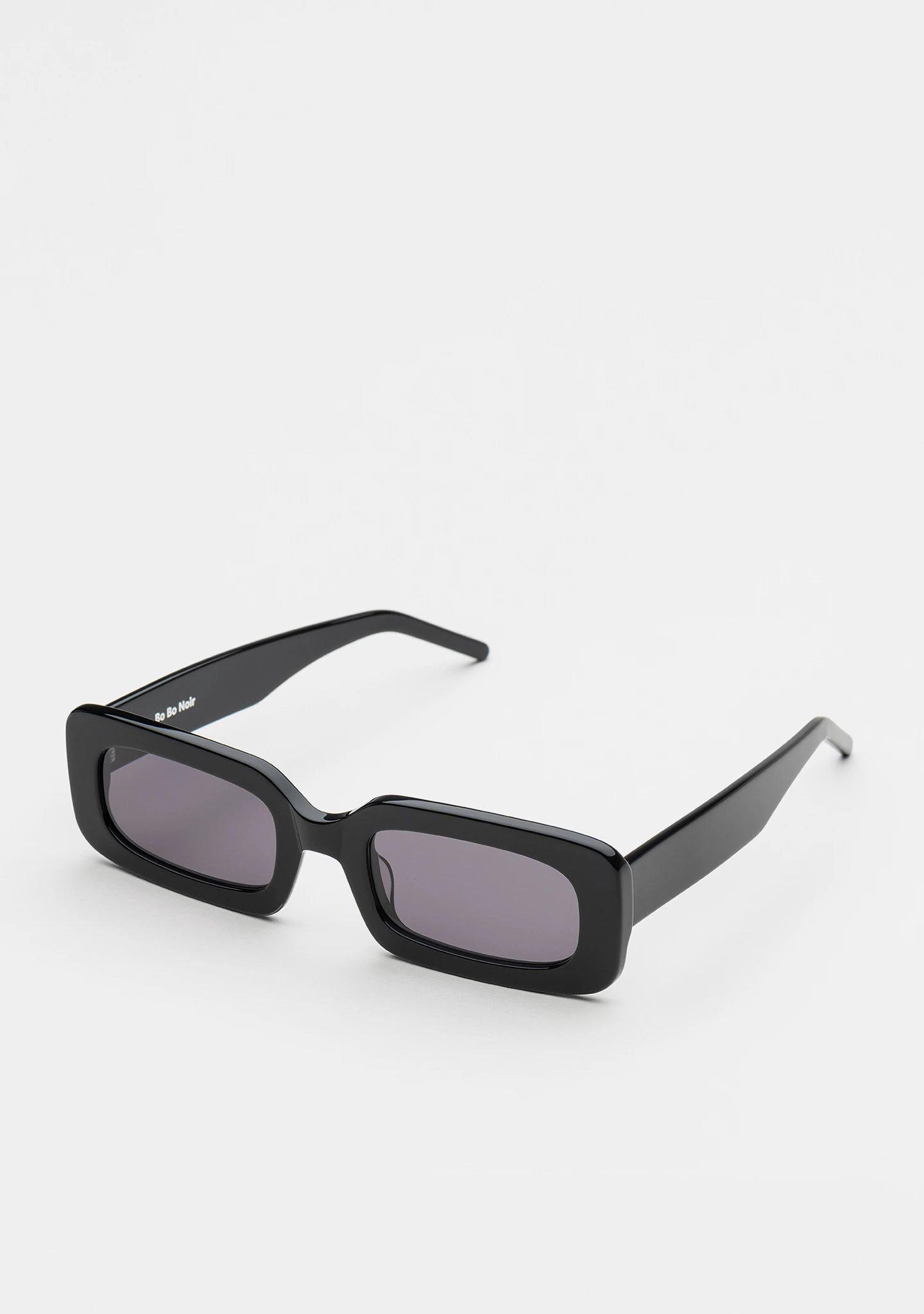 Bo Bo Noir Jane rectangular sunglasses in shiny black acetate, 45-degree view.