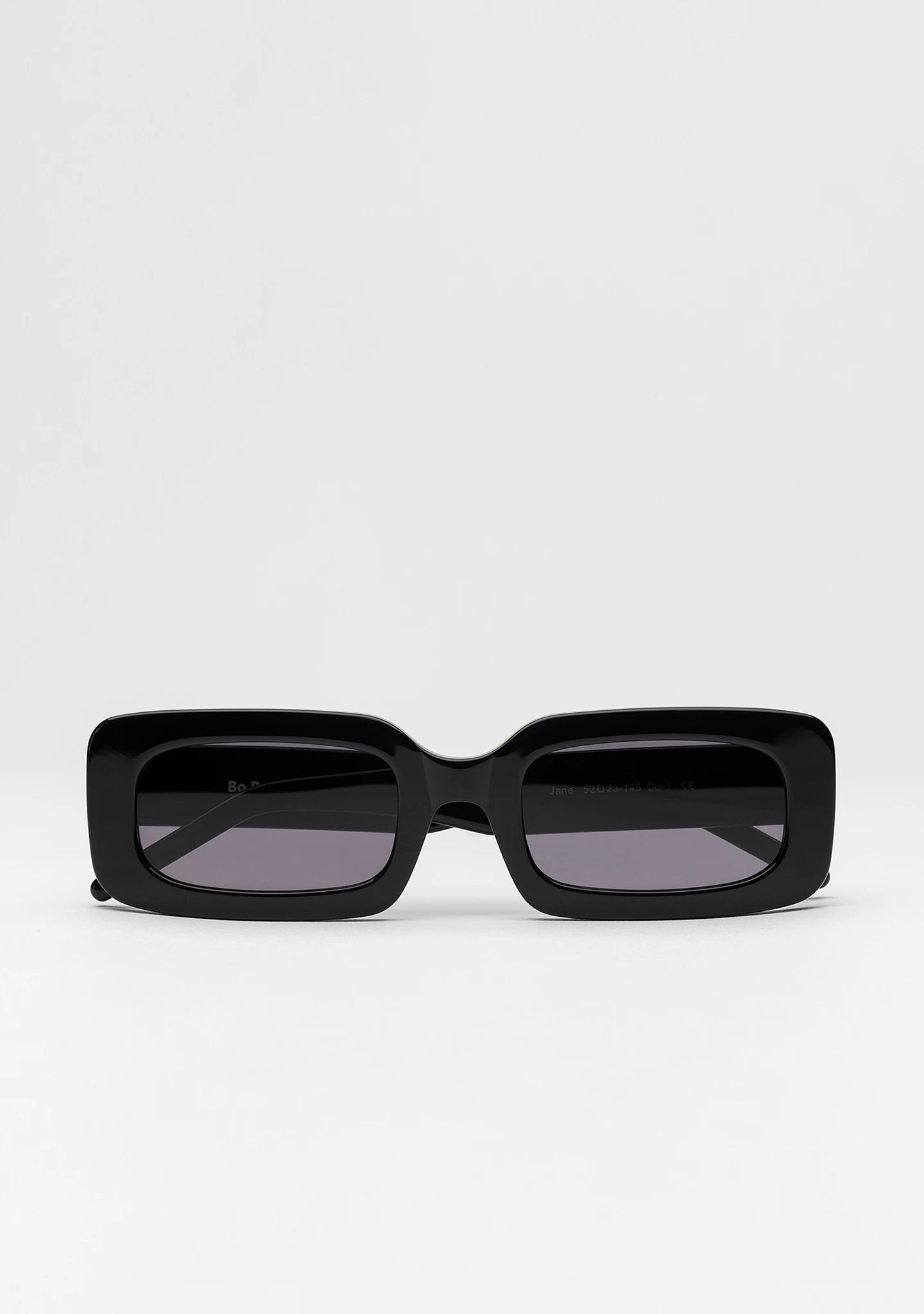 Bo Bo Noir Jane rectangular sunglasses in shiny black acetate, front view.