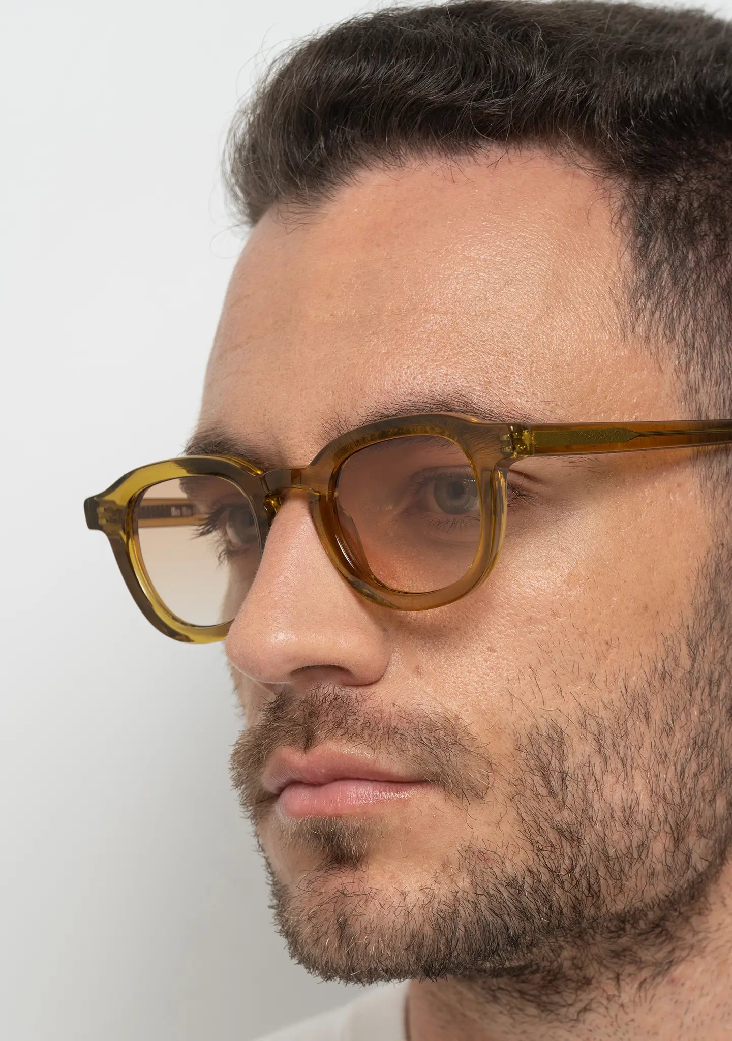 mens sunglasses Bo Bo Noir Narr panto round in olive yellow acetate with gradient nylon lenses, man wearing, side view.