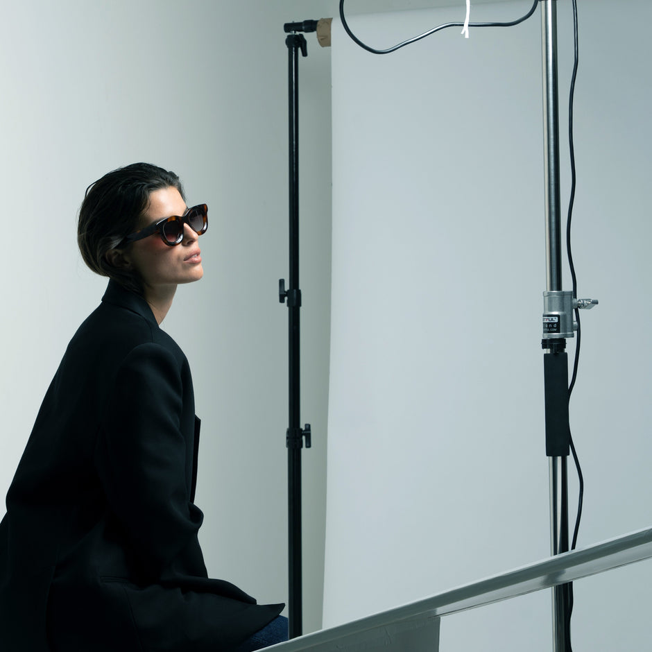 Timeless unisex sunglasses in the style of Peter and May, worn by a man and woman outdoors