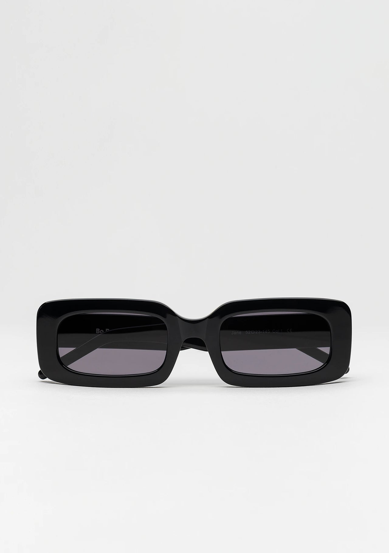Bo Bo Noir Jane rectangular sunglasses in shiny black acetate, front view.