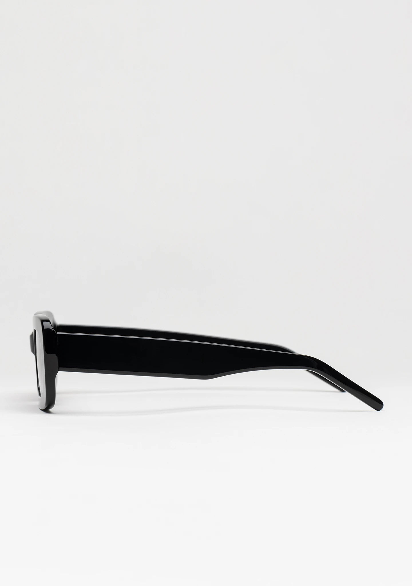 Bo Bo Noir Jane rectangular sunglasses in shiny black acetate, side view.