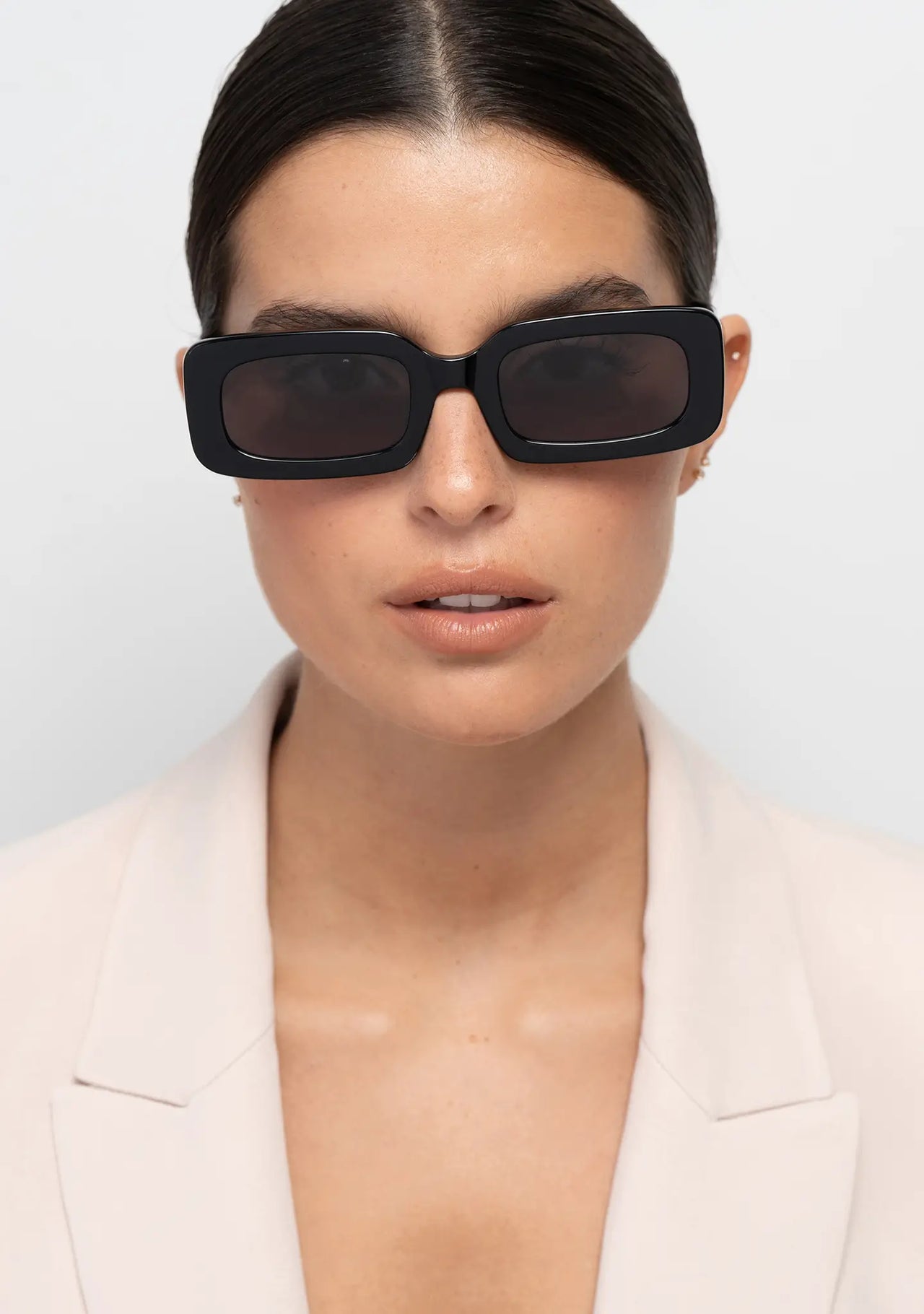 Bo Bo Noir Jane shiny black rectangular womens sunglasses, woman wearing, front view.