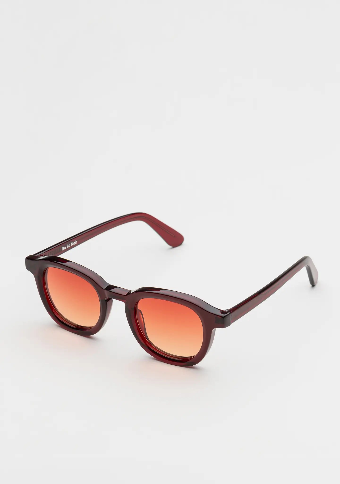 Bo Bo Noir Narr panto round sunglasses in deep burgundy acetate with gradient sunset red nylon lenses, 45-degree view.