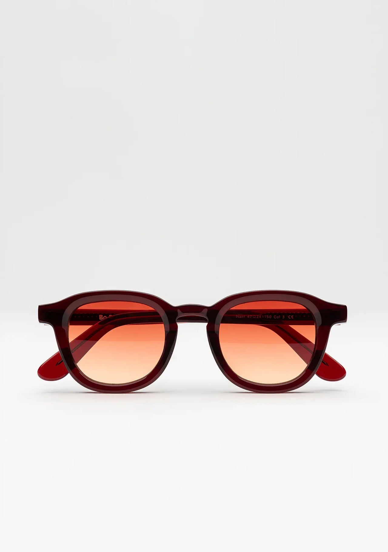Bo Bo Noir Narr panto round sunglasses in deep burgundy acetate with gradient sunset red nylon lenses, front view.