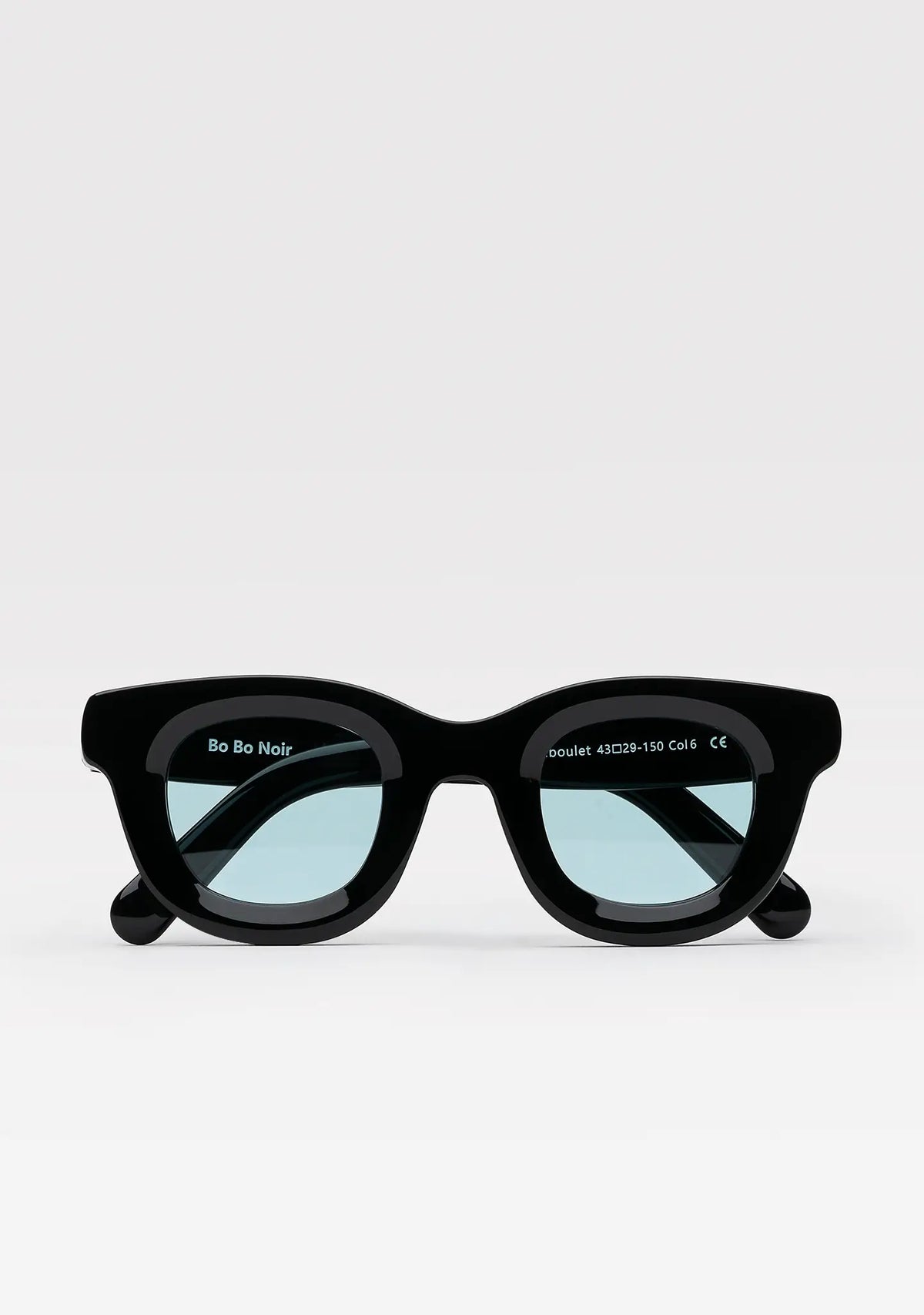Triboulet panto sunglasses with shiny black acetate frame and light blue lenses, front view