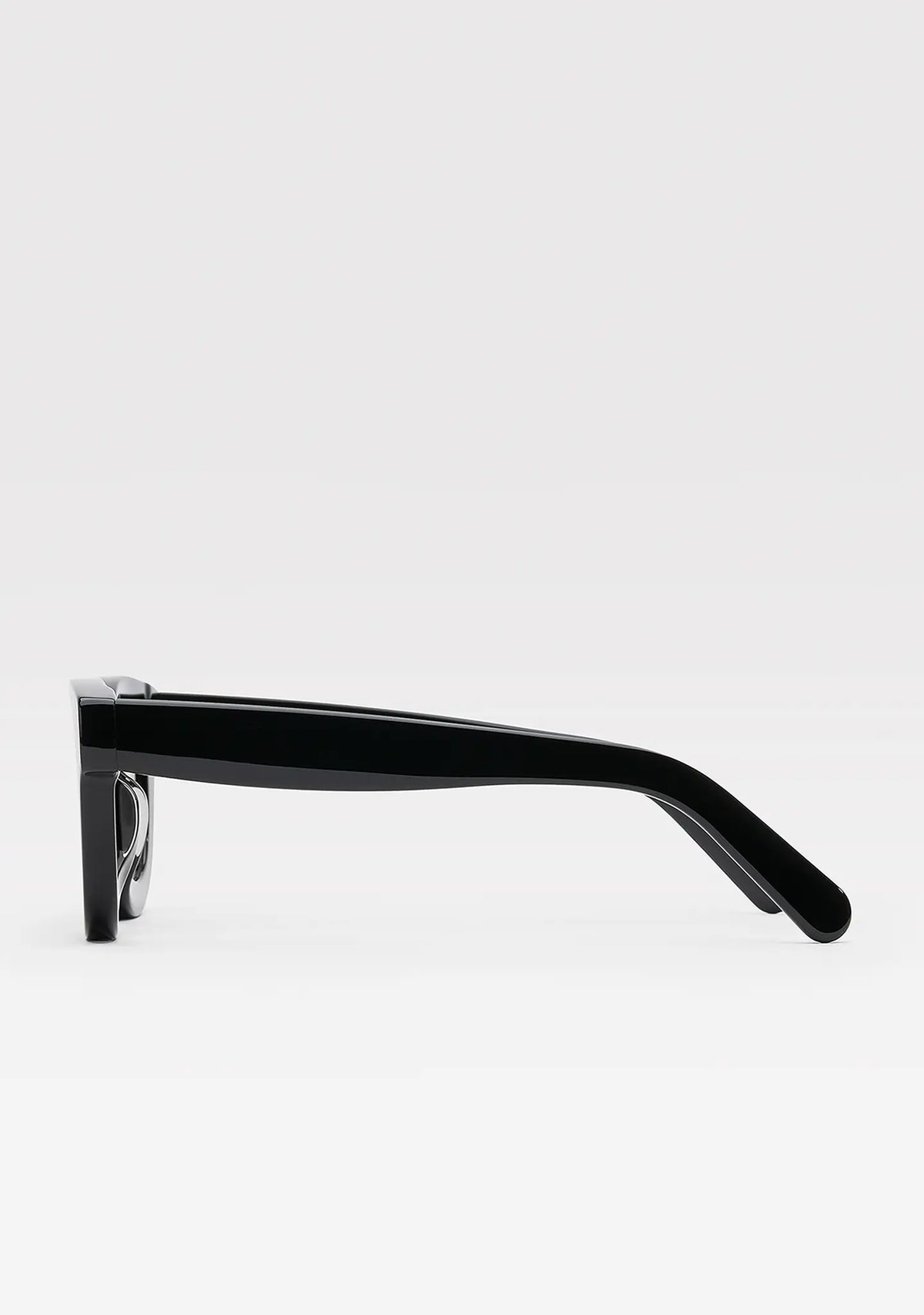 Triboulet panto sunglasses with shiny black acetate frame and light blue lenses, side view