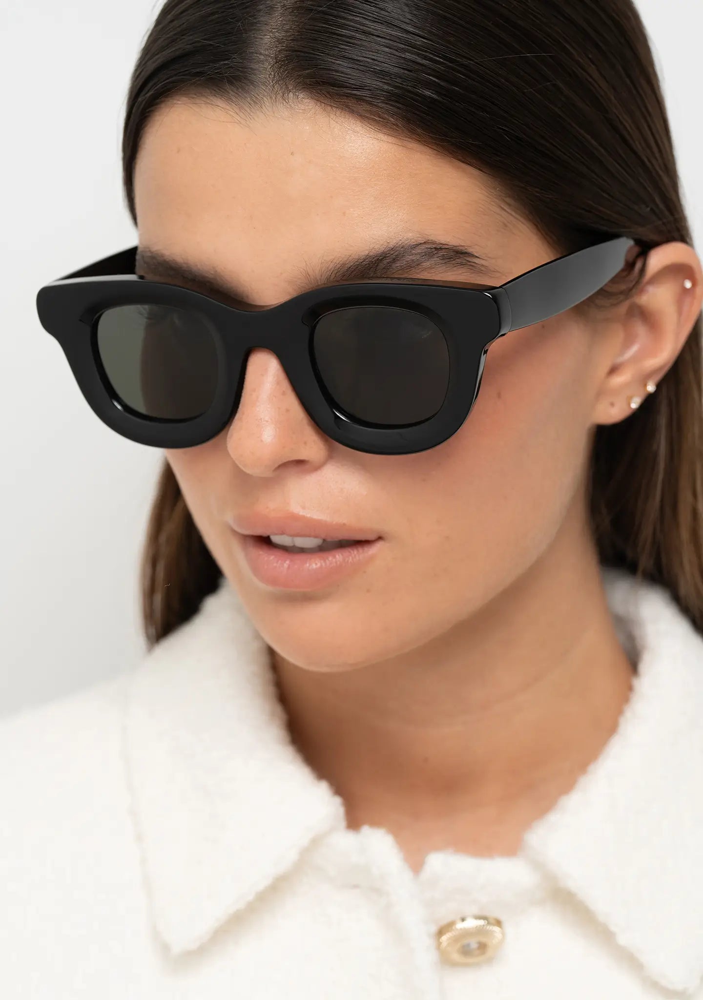 womens sunglasses Bo Bo Noir Triboulet panto round in shiny black acetate with gray nylon lenses, woman wearing, profile view.