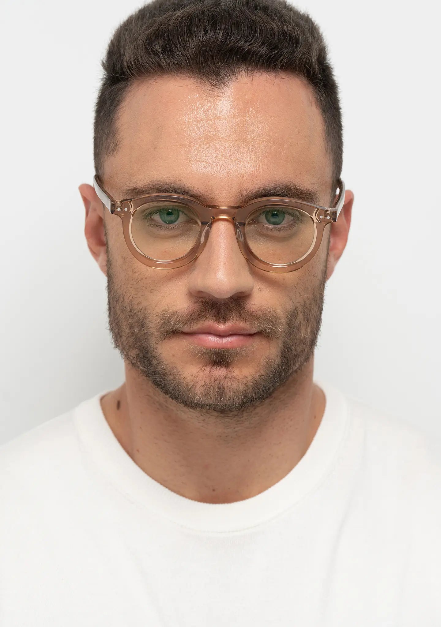 mens William crystal peach bold round blue light blocking glasses worn by a man