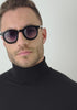 mens sunglasses Bo Bo Noir William round in shiny black acetate with CR-39 gradient blue lenses, man wearing, slow motion head turn side to front.